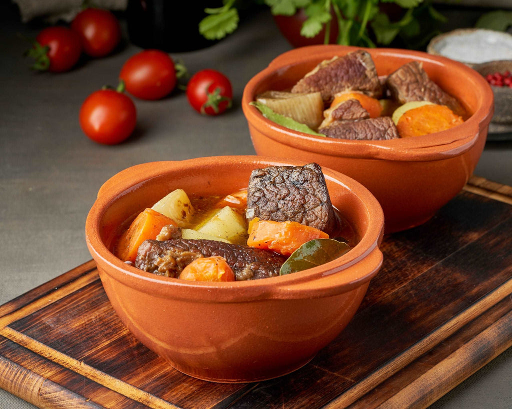 Goulash with large pieces of beef and vegetables. Burgundy meat. Slow stewing