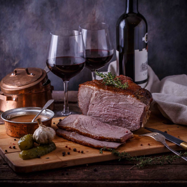 Roast beef and red wine, dark photo