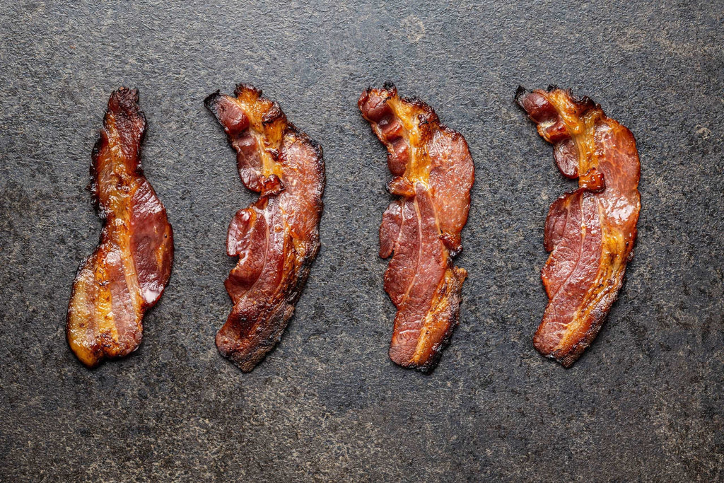 Fried bacon. Sliced roasted bacon.
