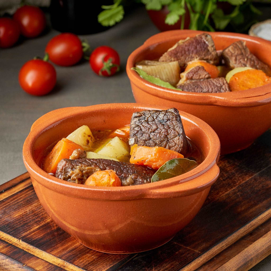 Goulash with large pieces of beef and vegetables. Burgundy meat. Slow stewing