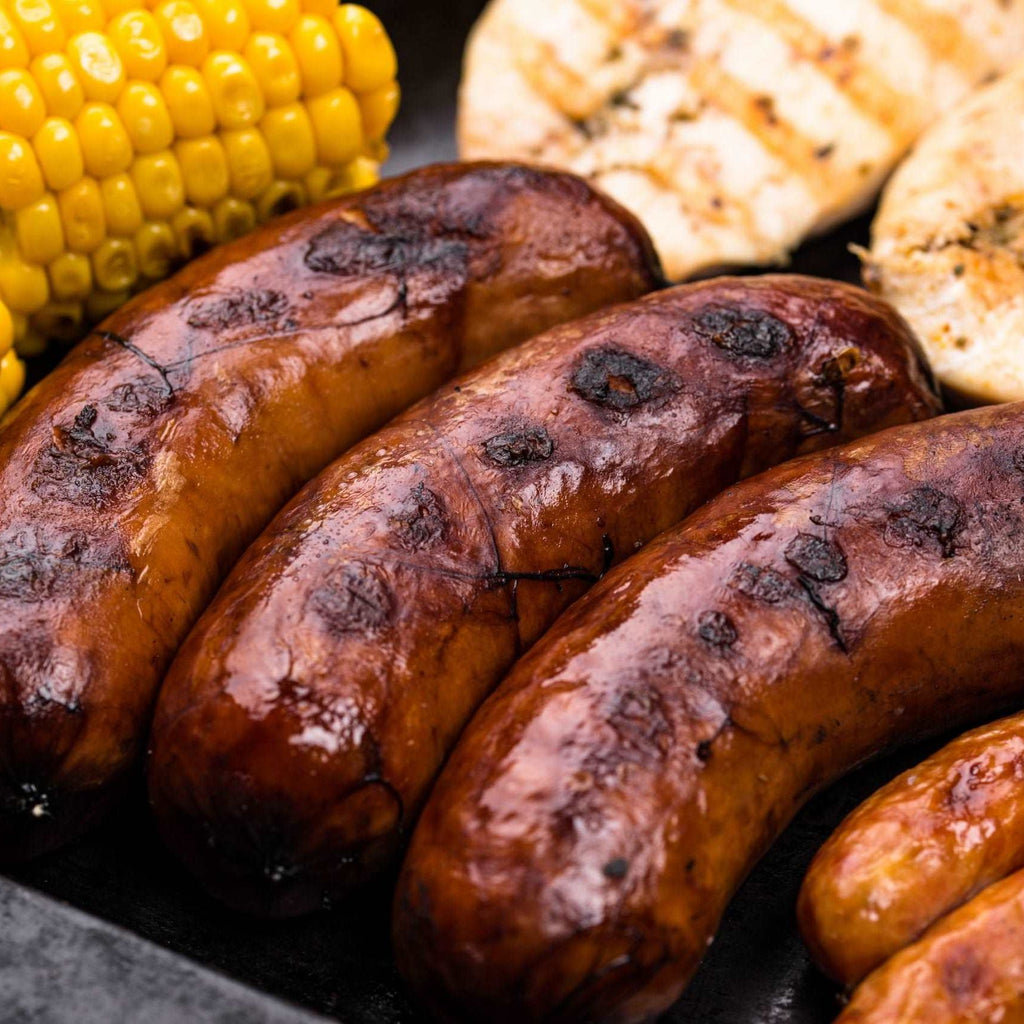 Grilled sausages, meat, and vegetables.