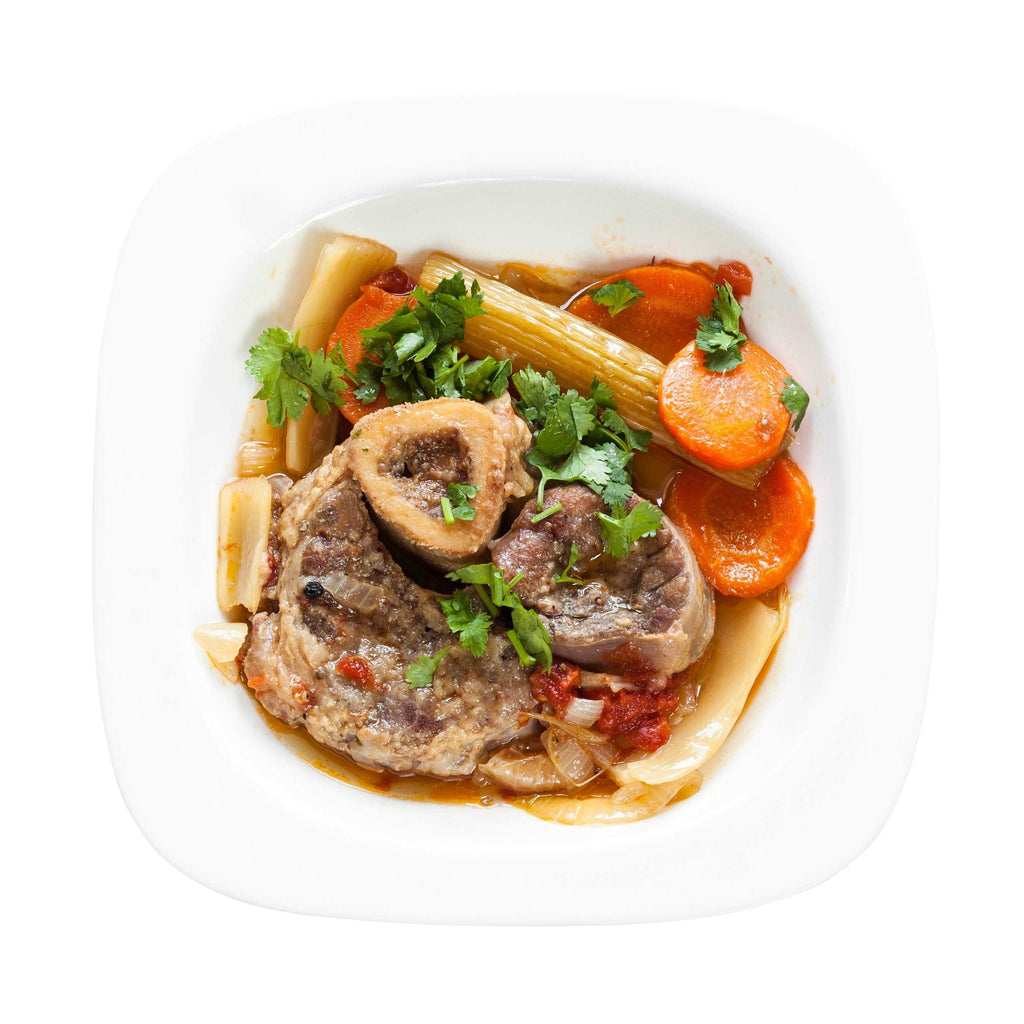 italian dish Ossobuco in white plate isolated